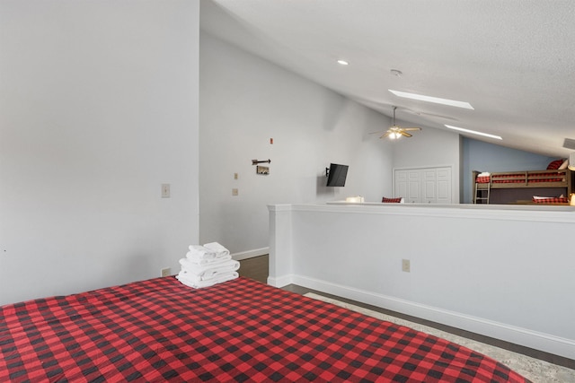 unfurnished bedroom with lofted ceiling with skylight