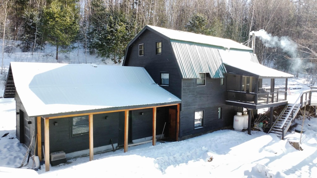 view of snow covered house