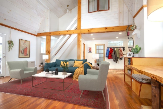 living room featuring dark wood-type flooring, wood ceiling, and high vaulted ceiling