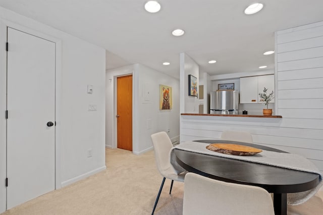 view of carpeted dining space