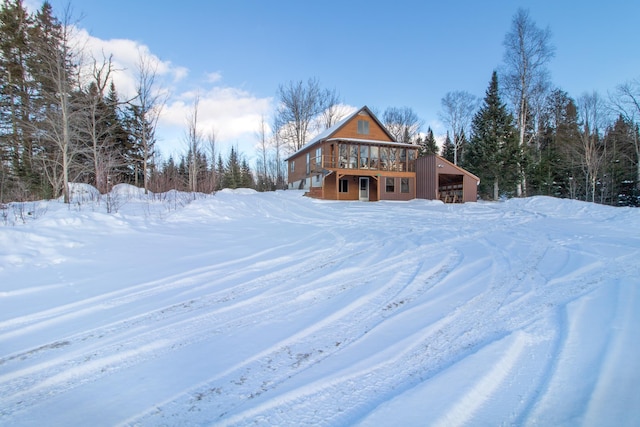 snowy yard with a wooden deck