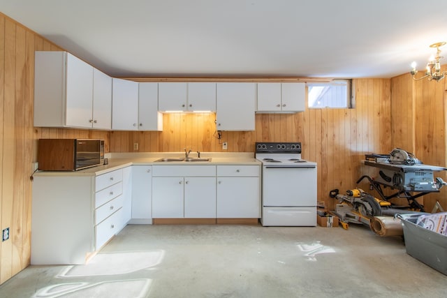 kitchen with white cabinets, wood walls, sink, and white range with electric stovetop