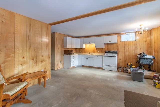 kitchen featuring wooden walls, white cabinetry, sink, a chandelier, and white range with electric cooktop