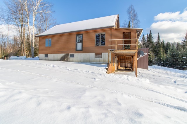 view of snow covered house