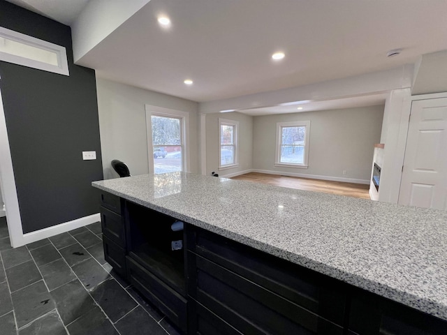 kitchen with light stone countertops