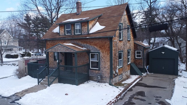 view of front of house featuring an outbuilding and a garage