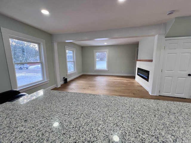 unfurnished living room featuring hardwood / wood-style floors