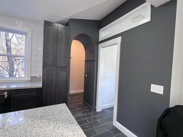 kitchen featuring light stone counters