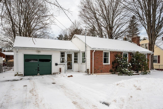 single story home featuring a garage