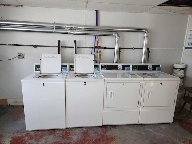 clothes washing area featuring washing machine and clothes dryer