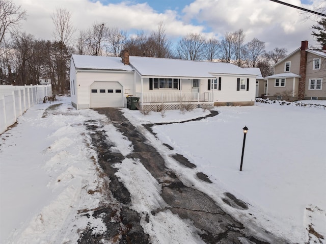 view of front of home featuring a garage and a porch