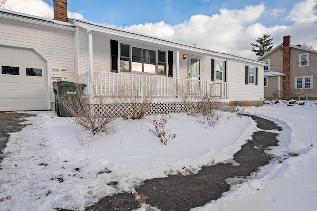 view of front of house with a garage and covered porch