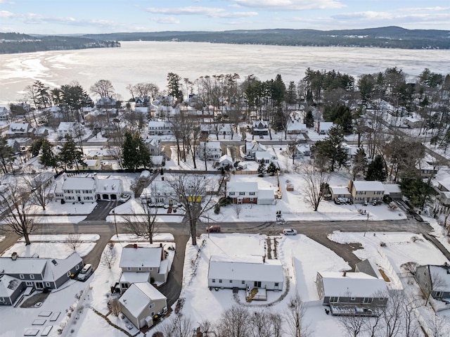 snowy aerial view with a mountain view