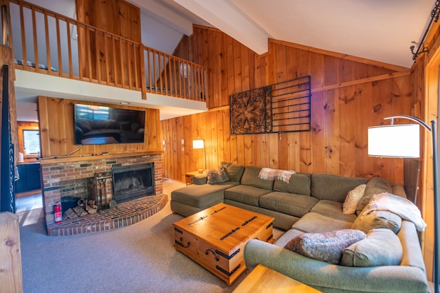 carpeted living room featuring vaulted ceiling with beams and a fireplace