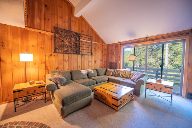 carpeted living room with wooden walls and lofted ceiling with beams