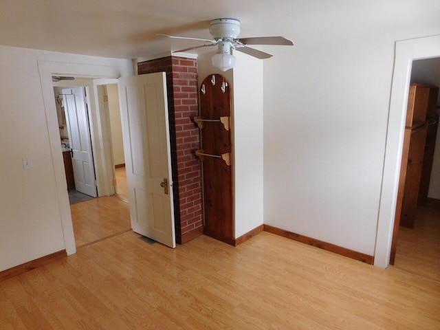 unfurnished bedroom featuring light hardwood / wood-style flooring and ceiling fan