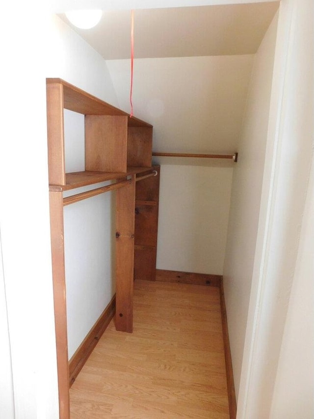 walk in closet featuring light wood-type flooring