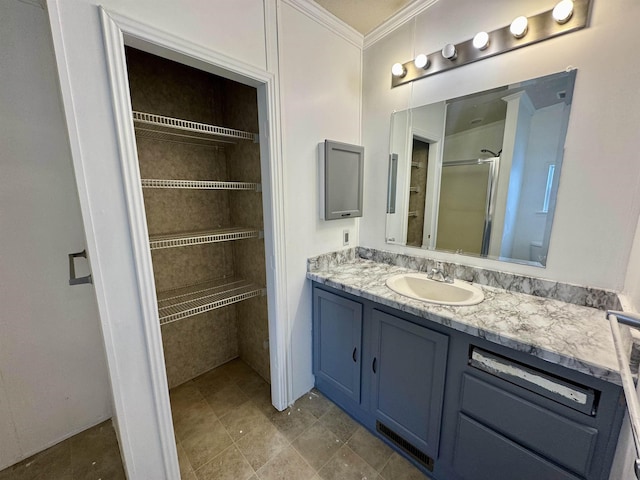 bathroom with vanity and ornamental molding