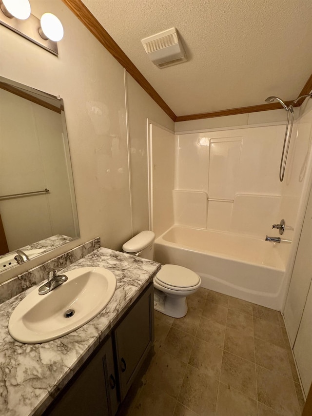 full bathroom with crown molding, vanity, a textured ceiling, shower / washtub combination, and toilet