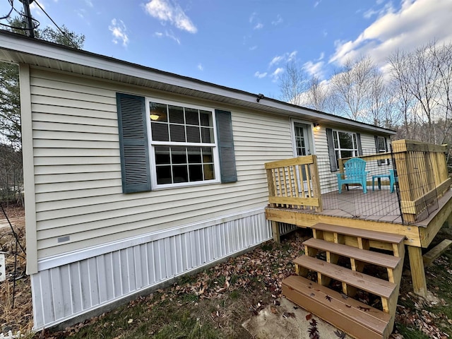 back of house featuring a wooden deck