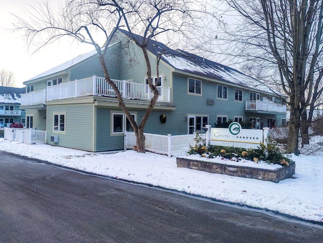 exterior space with a balcony and central AC unit