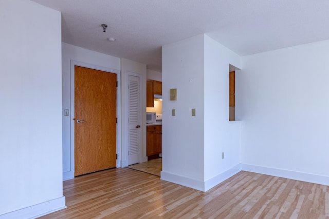 unfurnished room featuring light hardwood / wood-style floors