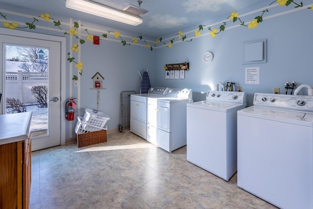 laundry room with washer and dryer