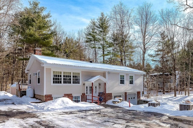 split foyer home featuring a garage