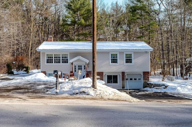 bi-level home featuring a garage