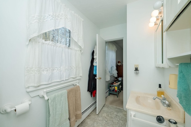 bathroom featuring vanity and a baseboard radiator