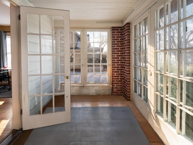 unfurnished sunroom with french doors