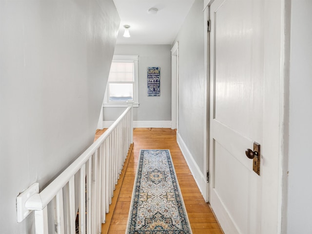 corridor with light wood-type flooring