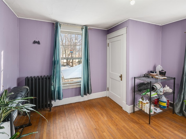 interior space featuring hardwood / wood-style floors and radiator heating unit