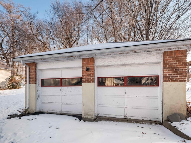 view of snow covered garage