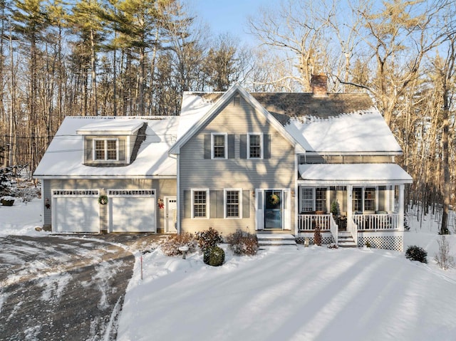 view of front facade with a garage and covered porch