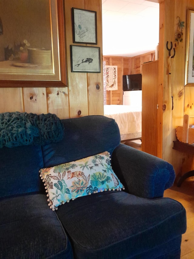 living room featuring wood walls