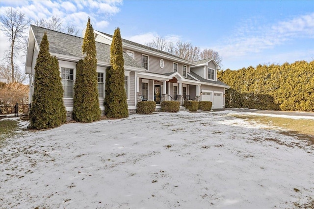 view of front of home with a porch and a garage