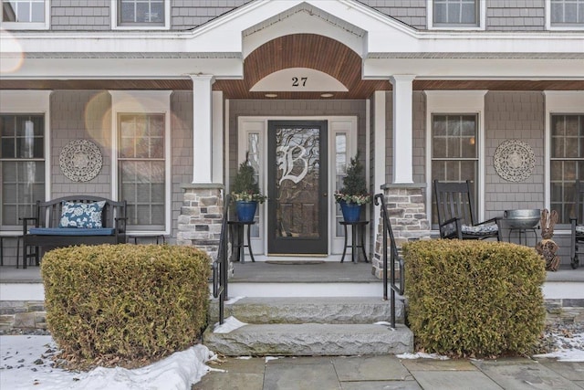 doorway to property with covered porch