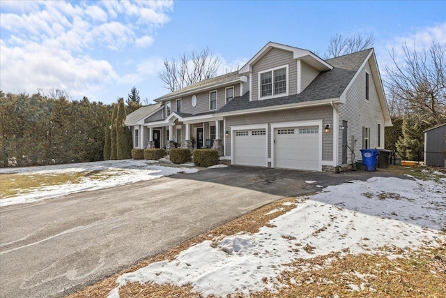 view of front of home featuring a garage and a porch