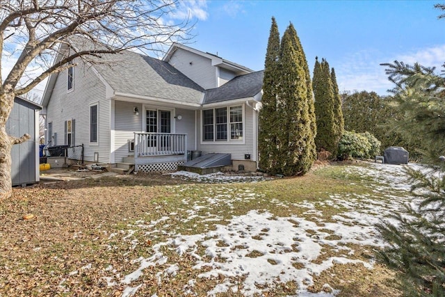 snow covered property featuring a deck