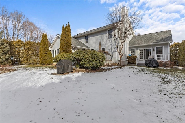 view of snow covered house