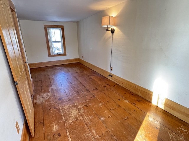 empty room featuring wood-type flooring