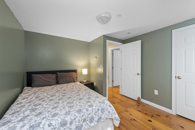 bedroom with wood-type flooring