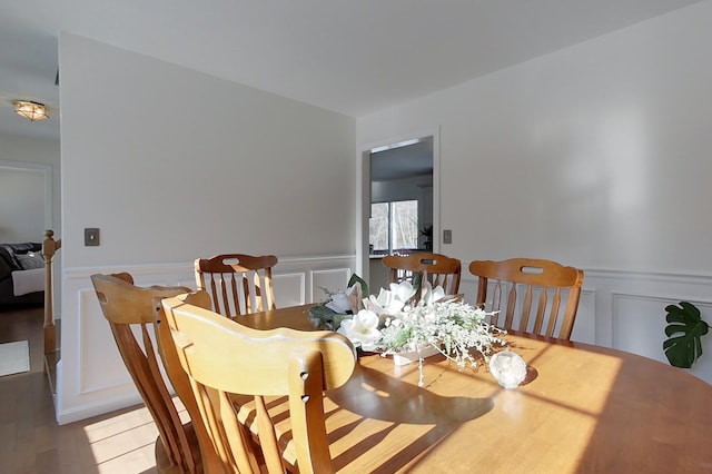 dining space featuring hardwood / wood-style flooring