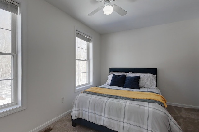 carpeted bedroom with ceiling fan