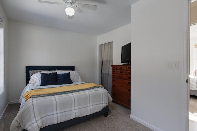 bedroom with ceiling fan and carpet flooring