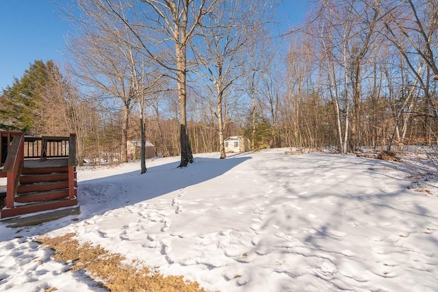 view of yard layered in snow