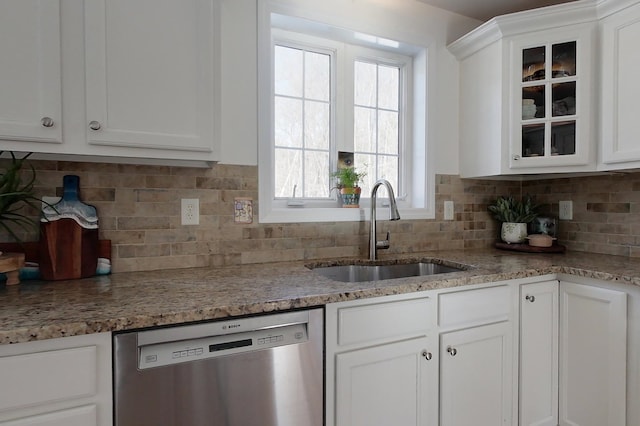 kitchen with white cabinetry, sink, backsplash, and dishwasher