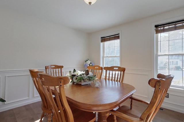 dining room with wood-type flooring