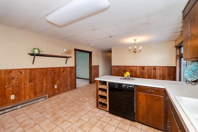 kitchen with sink, baseboard heating, black dishwasher, a notable chandelier, and decorative light fixtures